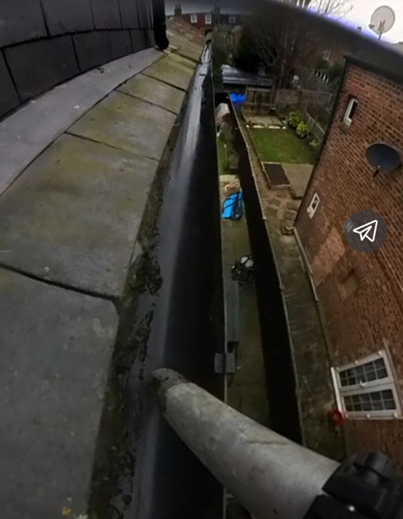 Daves Gutters professional gutter cleaning team operating a skyVac Nitro vacuum system from ground level, cleaning gutters safely without ladders at a London property.